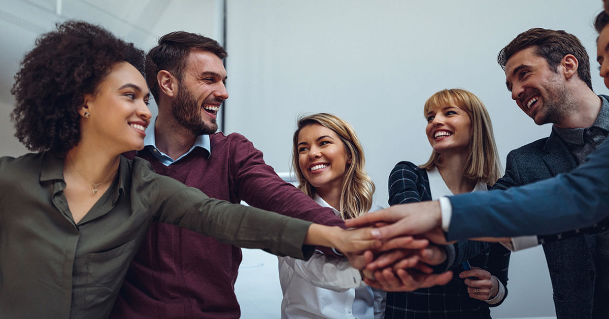 Stack of hands showing teamwork