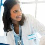 Female doctor smiling to a patient