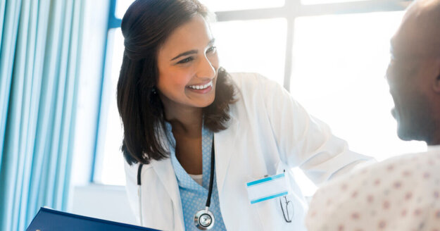 0010_The-Impact-of-Racism Female doctor smiling to a patient
