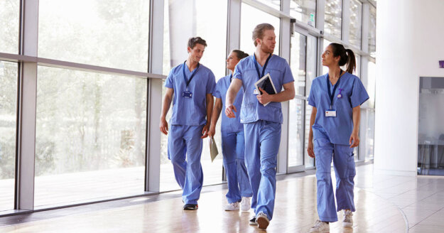 medical staff walking in the hallway