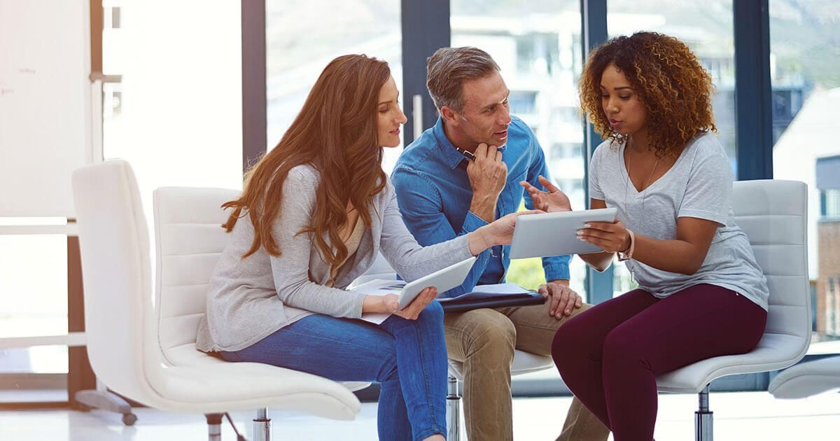 three people discussing