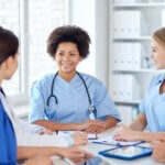 group of happy doctors meeting at hospital office